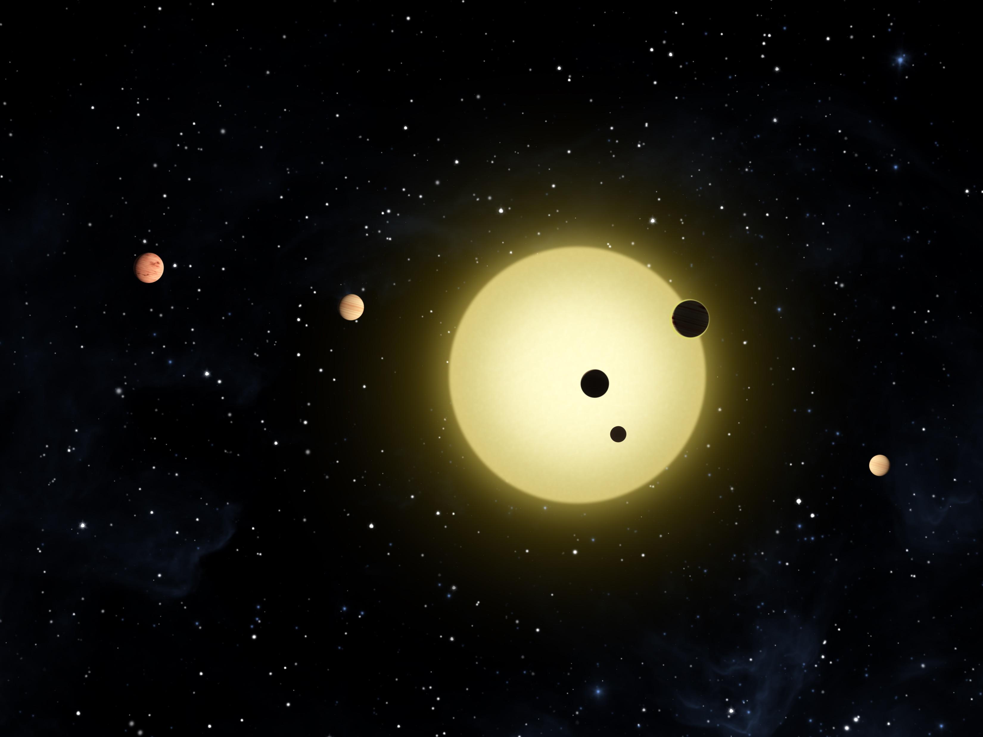 השמש קפלר 11 וכוכבי הלכת המקיפים אותה. איור: נאס"א