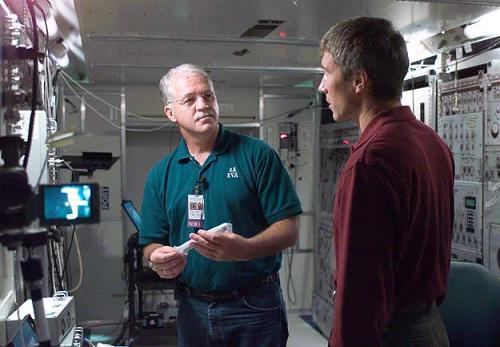 International Space Station Crew 11 Commander Sergey Kryklav (right) of Russia and Chief Engineer American Astronaut John Phillips participate in training sessions on a model of the space station at the Johnson Space Center in Houston. The two will replace the American commander Leroy Chiao and the Russian flight engineer Shalyzhan Sharipov. Photo: NASA.