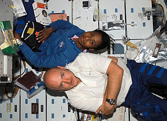 Stephanie Wilson and Mark Kelly are floating on the shuttle Discovery