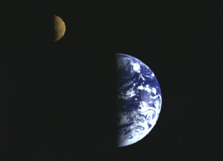 The Earth and the Moon, as photographed from the Galileo spacecraft as it began to move away from the Earth shortly after its launch