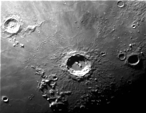 Countless many craters cover the surface of the moon. The large crater in the middle of the picture, the Copernicus crater, is one of the most well-known craters on the moon.