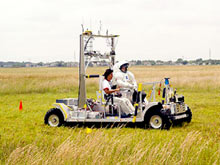 In the photo, the vehicle test in the grass fields at the Johnson Space Center