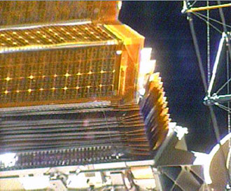 The solar panel is half folded in the space station