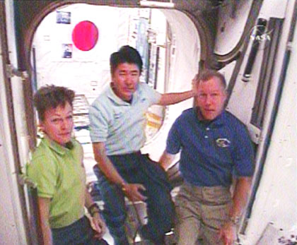 From the left - Peggy Whitson, commander of the space station's 16th flight, Japanese astronaut Takao Doi, and Endeavor commander Dominic Gorey during their conversation with the Prime Minister of Japan