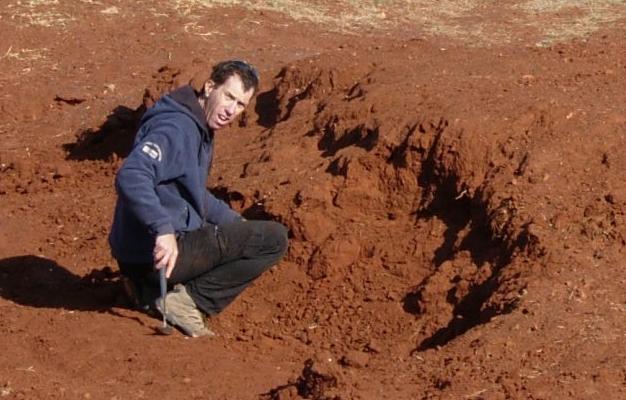 Dr. Ari Matmon from the Hebrew University takes soil samples outside the cave