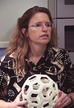 Dr. Becker with a model of 'Bucky' balls containing extraterrestrial material Photo: University of Washington