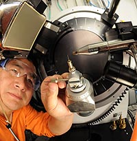 Dr. Yu-Sheng Chen of Northwestern University calibrates the device that detects the radiation