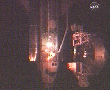 The space shuttle Discovery is docked at the space station. Photo from the station