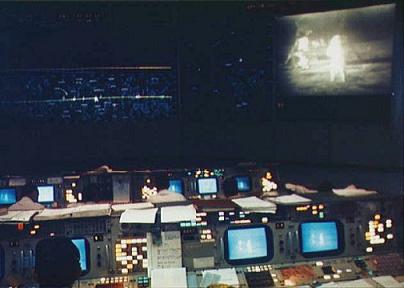 The control room on the background of the pictures from the moon in Apollo 11