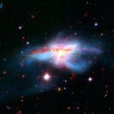 הגלקסיה NGC 6240 - תוצר של התנגשות בין שתי גלסקיות גדולות הגלקסיה NGC 6240 - תוצר של התנגשות בין שתי גלסקיות גדולות