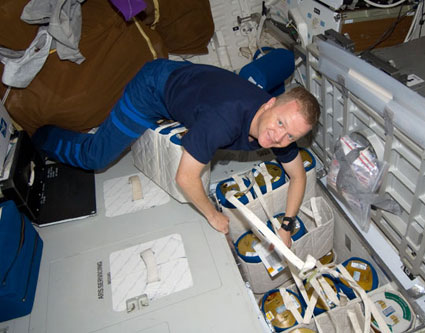 Shuttle pilot Eric Bo performs activities in the spaceship before preparations for landing, which are delayed in the meantime