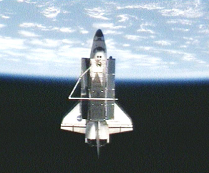 The space shuttle Discovery during the orbit of the space station before its departure, today