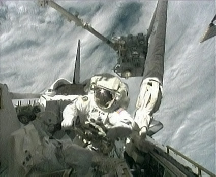 Tim Kupra works on the outside of Japan's Kibo Laboratory on the International Space Station this evening