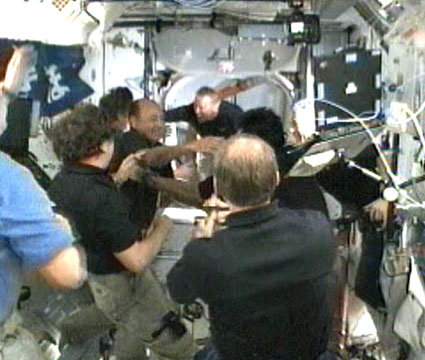 The welcoming ceremony at the space station for the crew members of Endeavour, tonight. Photo: NASA TV