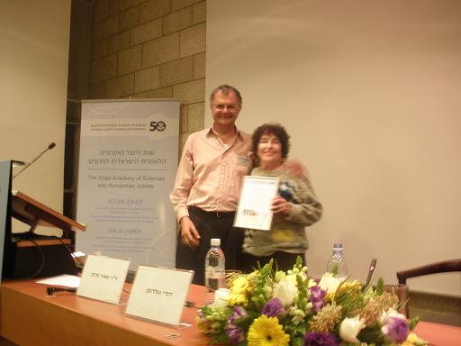 Dr. Meir Zadok, Dean of the Academy of Sciences presents the certificate of appreciation to Dr. Zohar Gori Dr. Meir Zadok, Dean of the Academy of Sciences presents the certificate of appreciation to Dr. Zohar Gori