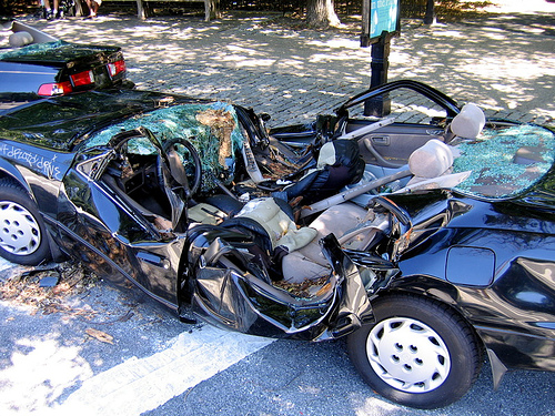Cars damaged by a falling tree in Brooklyn, New York. Photo: user Macronin47, flickr site
