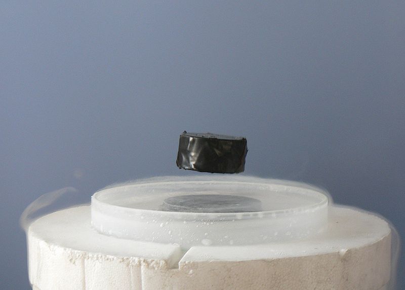 A magnet hovers over a superconductor at a high temperature cooled by liquid nitrogen. Photo: Wikipedia