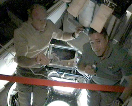 Inauguration ceremony of the copula component. Right: George Zemke, Endeavor Commander, and Jeff Williams, Station Commander