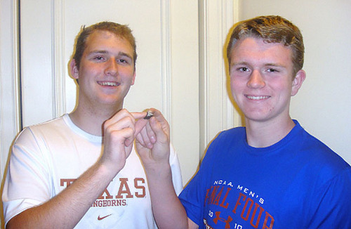 Christopher and Ivan Bordeaux hold the meteorite that fell on April 14, 2010 in Wisconsin, a remnant of what was previously seen in the sky as a giant fireball. The stone was recovered 22 hours after its fall. Photo: Terry Bordeaux, uploaded by Michael Johnson to "Rocks From Space" courtesy of Universe Today