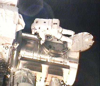 Astronaut Rick Mastracho exiting the Quest lander at the space station, April 9, 2010