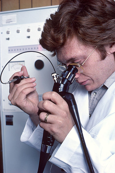 A doctor uses an endoscope. NIH photo