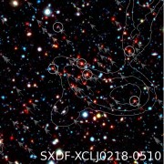 צביר הגלקסיות SXDF-XCLJ0218-0510 המרוחק 9.6 מיליארד שנות אור מאיתנו. הצביר המרוחק ביותר הידוע נכון למאי 2010. איור: מכון מקס פלנק לפיזיקה
