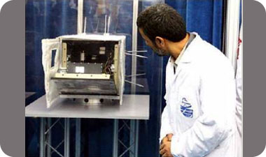 Iranian President Mahmoud Ahmadinejad examines an Iranian satellite that was supposed to be launched in 2008, but its launch failed