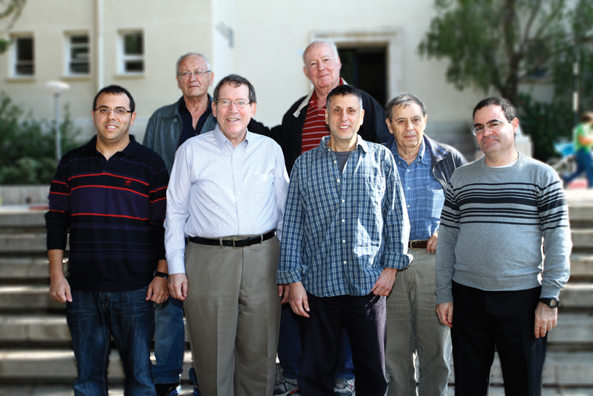 From the right: Dr. Moshe Goldsmith, Prof. Israel Silman, Prof. Dan Toufik, Prof. Yoel Zussman, Moshe Ben-David. (Back): Dr. Chaim Lider and Dr. Yaakov Eshani. Defense formation