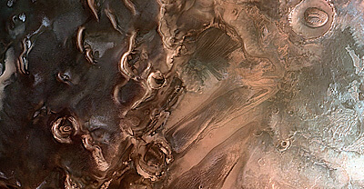 Ice deposits are buried in the south polar region of Mars, near Ulyxis Rupes at latitude 72 degrees south and longitude 162 degrees east. Photographed by the Mars Express spacecraft on January 15, 2011 with the high-resolution stereoscopic camera. South on the left, North on the right