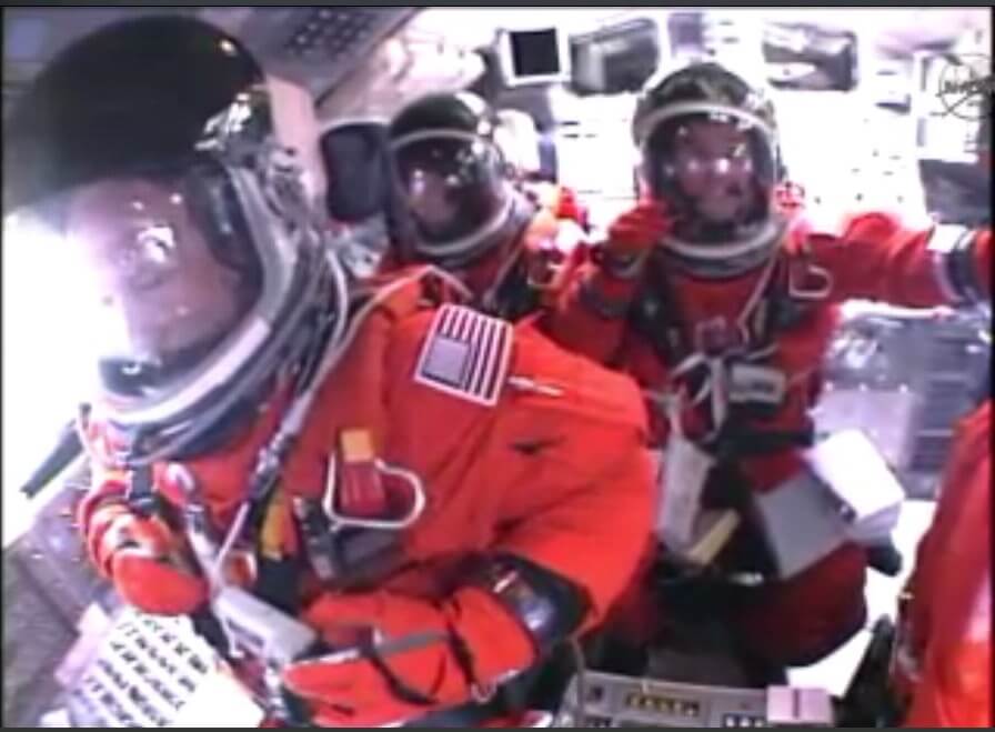 The astronauts in the Atlantis shuttle while climbing into space, 8/7/2011. Photo: NASA TV