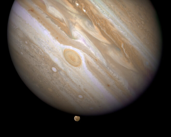 Jupiter and the moon Ganymede emerging behind him. Photo: NASA/ESA/E. Karkoschka (U. Arizona)