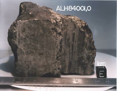 ALH 84001, the meteorite found in Antarctica in 1984. Alleged evidence of fossil life found within it ignited research to search for life. Photo: NASA/JSC