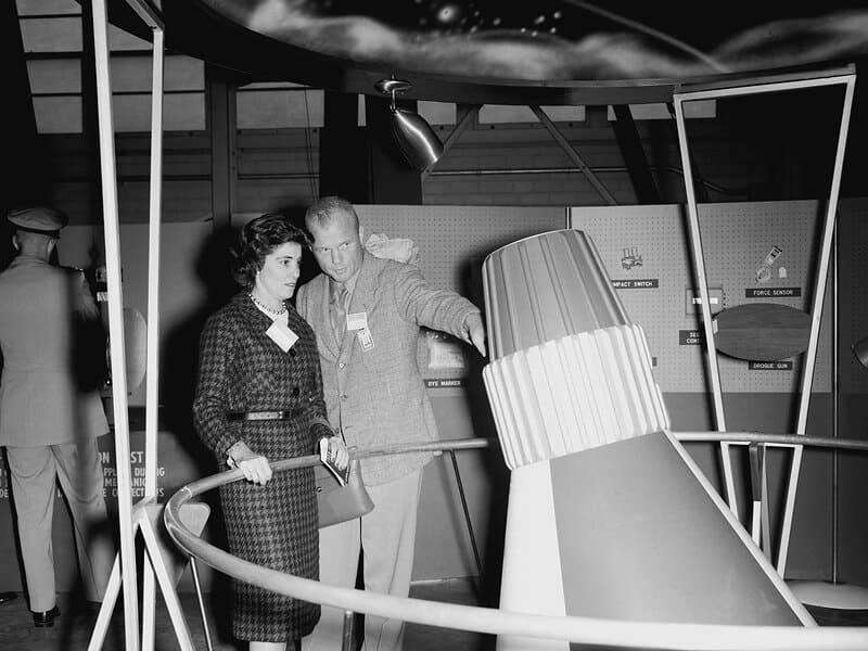 John Glenn explaining the structure of the Mercury capsule to his wife Anne during one of her visits to Langley in 1959. Photo: NASA