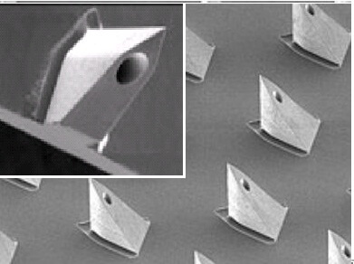 The figure shows an array of nanops micropyramids (right, 150x magnification) and a single microneedle (left, 750x magnification). These needles are sharp and stable enough to penetrate through the human skin layer almost completely painlessly.