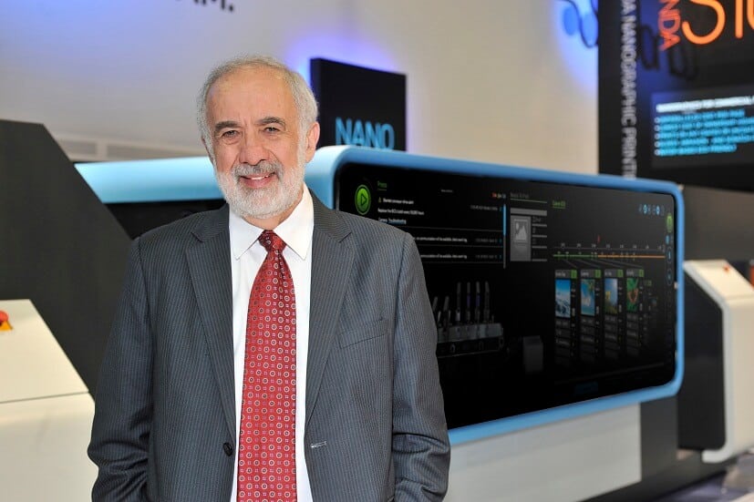 Benny Landa next to the printing press that uses nanometer ink, PR photo