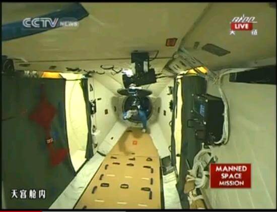 Shenzhou 9 spacecraft commander Jing Haifeng enters the Tiangong 1 space laboratory. Photo: Chinese TV