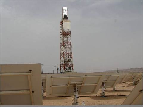 A solar tower and mirrors that direct the light to it at the SEDC site in the Rotem Industrial Park. Source: Wikipedia.