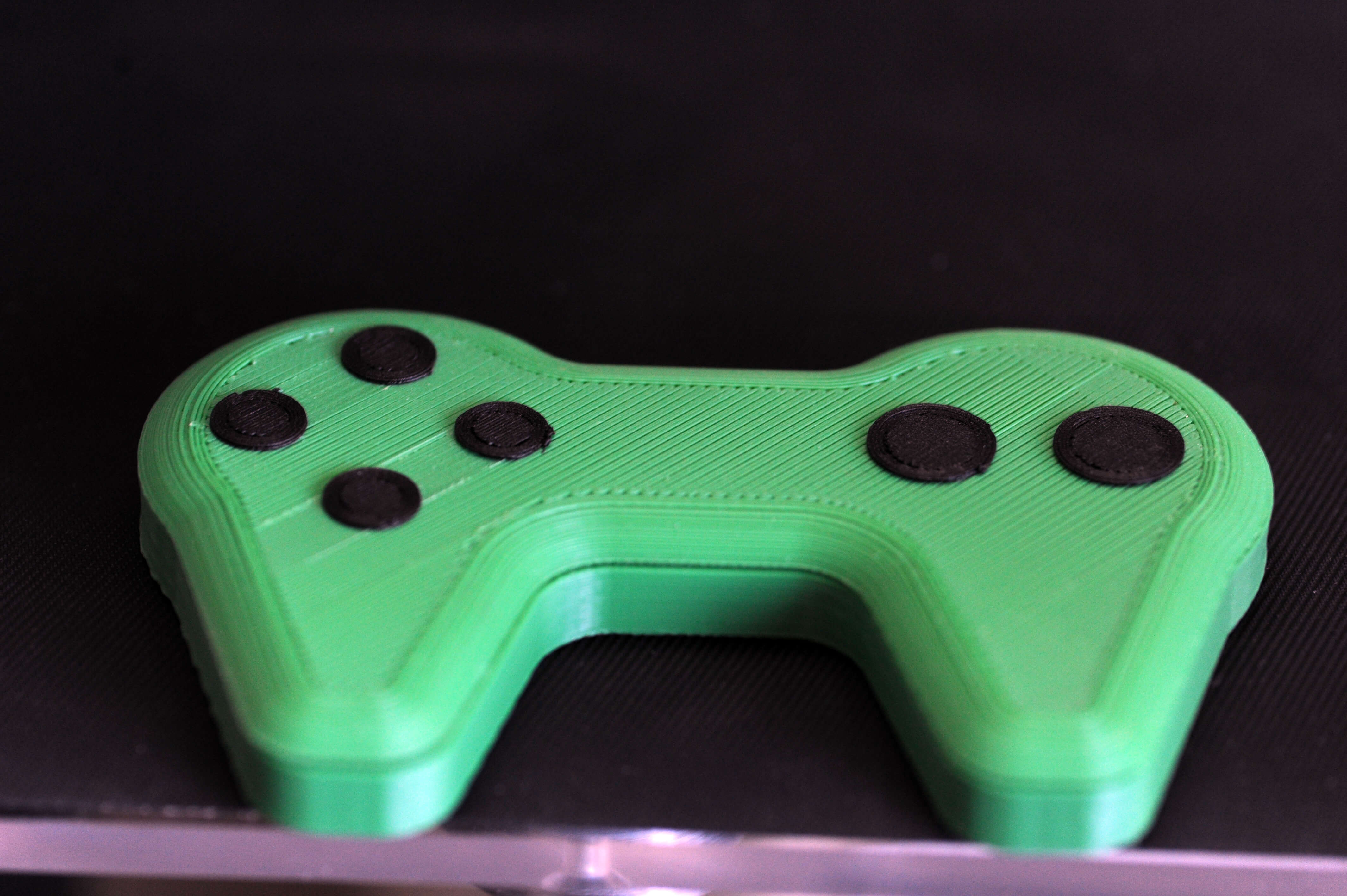 An example of a self-printable computer game controller from the new material