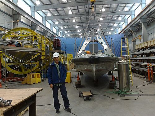 Professor Dreamer next to a boat (from a series of boats) that he designed. Photo - Technion Spokesperson.