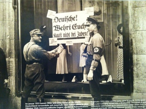 Photo of hanging a sign prohibiting purchases from Jewish stores on the eve of World War II at the Anne Frank Memorial Museum in Berlin (in the Hacker Market district), March 2013.