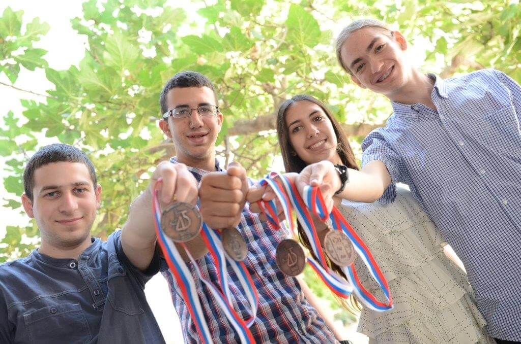 The winning students in the chemistry olympiad with the medals. From right to left: Roni Fromkin, Merah Zoevi, Roy Ilya and Uri Teichman.