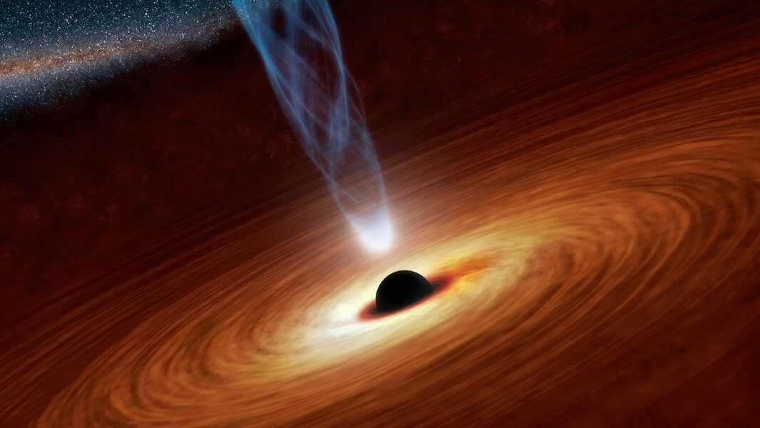 תפיסת אמן של חור שחור מאסיבי במיוחד בעל מיליוני-מיליארדי מסות שמש. מדובר בעצמים דחוסים הקבורים במרכזיהן של הגלקסיות. צילום: NASA/JPL-Caltech