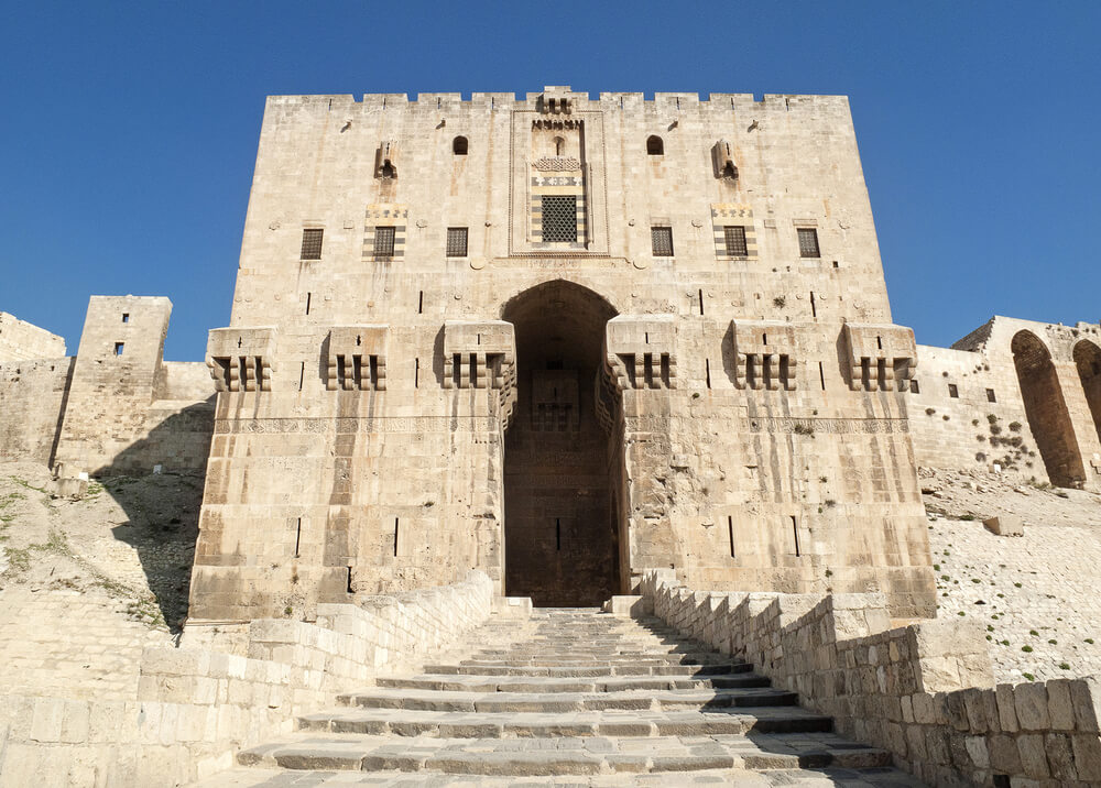 The citadel of the city of Aleppo rises above the old city in northern Syria, and contains remains of palaces, mosques and baths from the tenth century BC. Photo: shutterstock