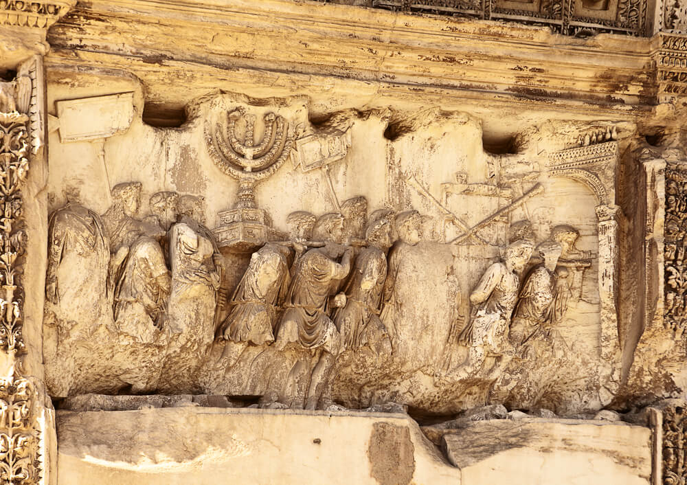 The menorah and other details looted from the Temple in Jerusalem, as depicted in the Titus Gate in Rome. Photo: shutterstock