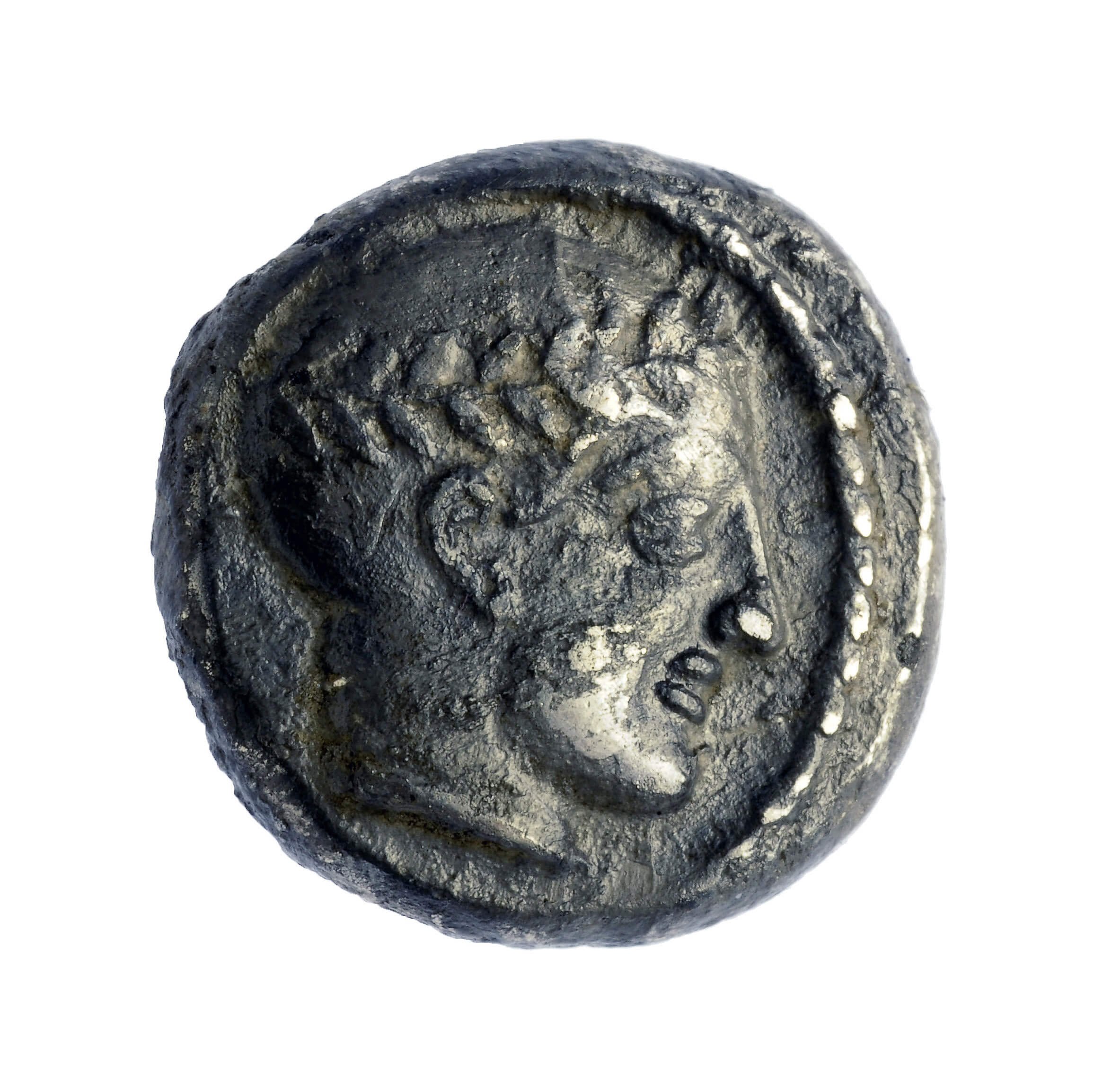 A coin from the reign of King Antiochus III. Photo: Clara Amit, courtesy of the Antiquities