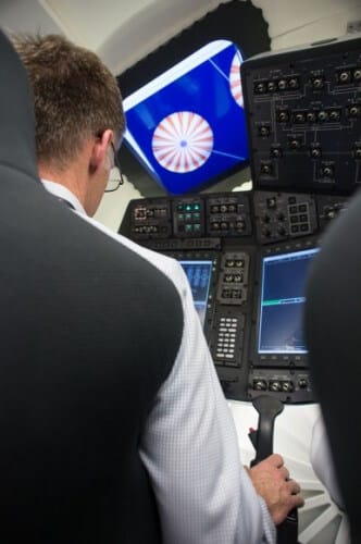 Chris Ferguson, the last commander of the space shuttle Atlantis, tries out the controls of Boeing's CST-100 spacecraft, which is slated to replace the shuttles and fly American astronauts to the International Space Station starting in 2017. Ferguson is now Boeing's crew and mission manager for the NASA-funded commercial manned spacecraft program. Photo: NASA/Boeing