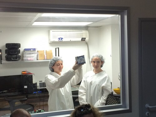 Two 1th grade students hold a model of the Dokifat 19 satellite in real size (and real materials) during the press conference on June 2014, XNUMX, Herzliya Science Center. Photo: Avi Blizovsky