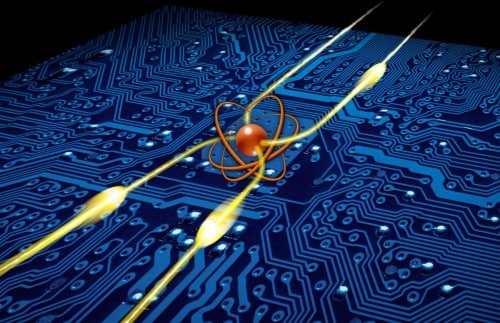 An illustration showing the photonic transistor created by the scientists. At its heart is a single atom (in orange) that directs photons (in yellow) in different directions