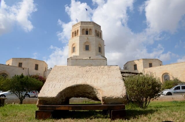 The image of the inscription against the background of the Rockefeller Museum building, home of the Antiquities Authority, photo: Yuli Schwartz, courtesy of the Antiquities Authority