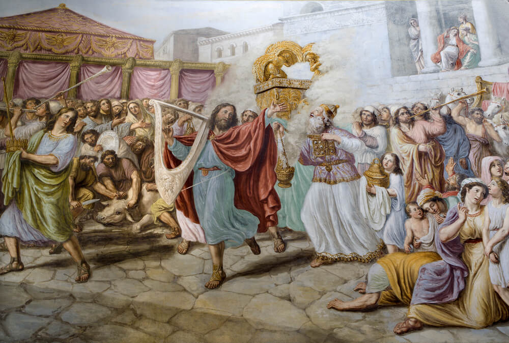 דוד המלך מנגן על הנבל. והעם יוצאים במחולות. ציור קיר בכנסיה בפירנצה. צילום: shutterstock